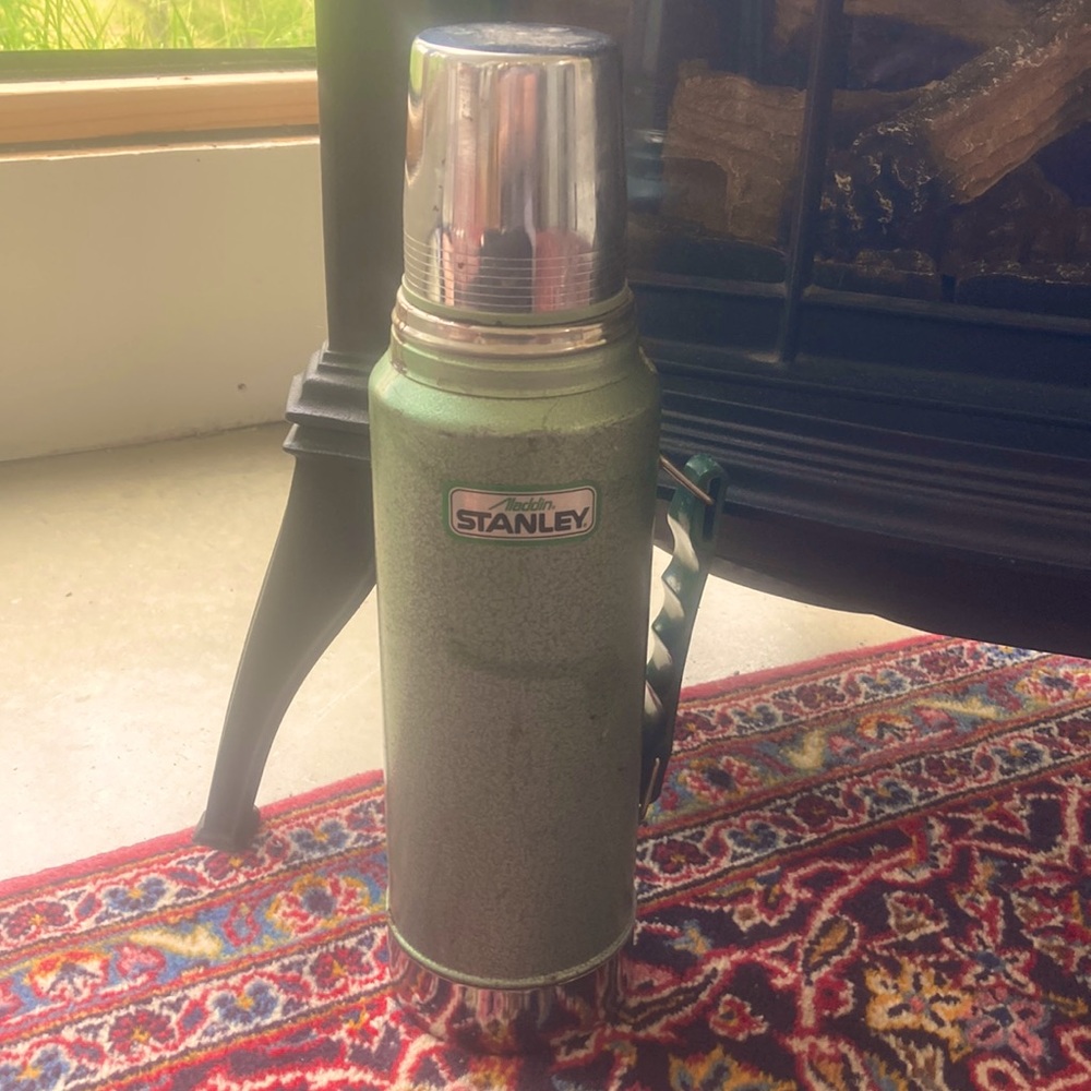Very vintage Stanley Aladdin green metal thermos canister with handle.